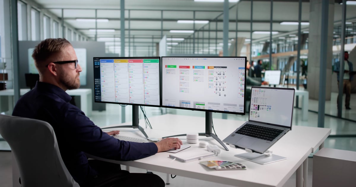 Creative Businessman Developing User-friendly Software On Office Computer Screen